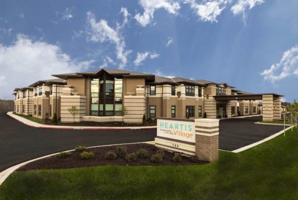 Pathway Heartis Village North Shore exterior view of sign, driveway and building in the background