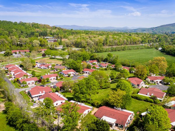 Pisgah Manor aerial view showing many trees and rooftops